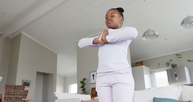 Young Girl Practicing Yoga at Home in Peaceful Living Room Setting - Download Free Stock Images Pikwizard.com