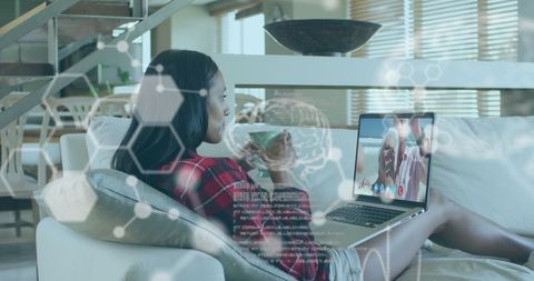 Woman engaging in virtual call with digital interface overlay