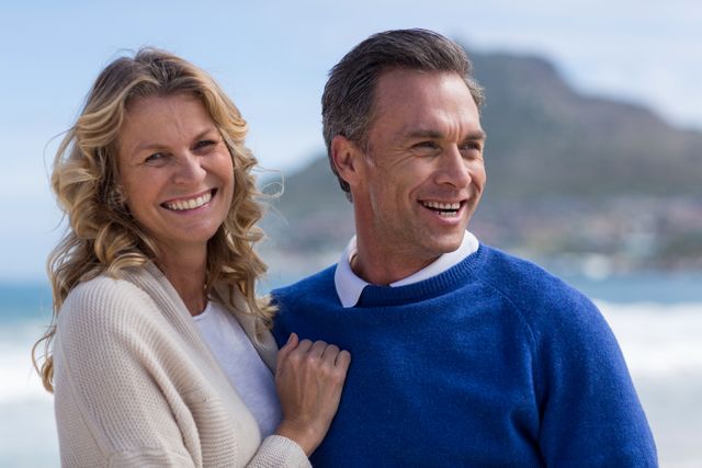 Romantic Mature Couple Smiling on Beach - Download Free Stock Photos Pikwizard.com