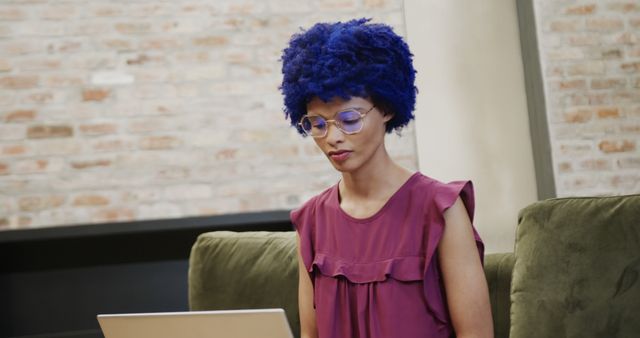 Woman with Blue Curly Hair Working on Laptop - Download Free Stock Images Pikwizard.com