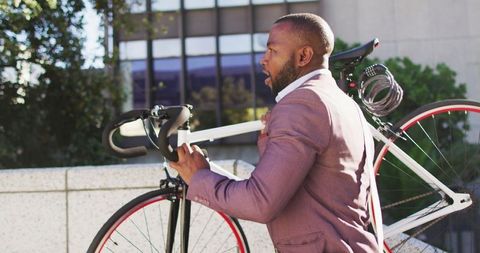 African American Man Carrying Bicycle in Urban Cityscape - Download Free Stock Images Pikwizard.com