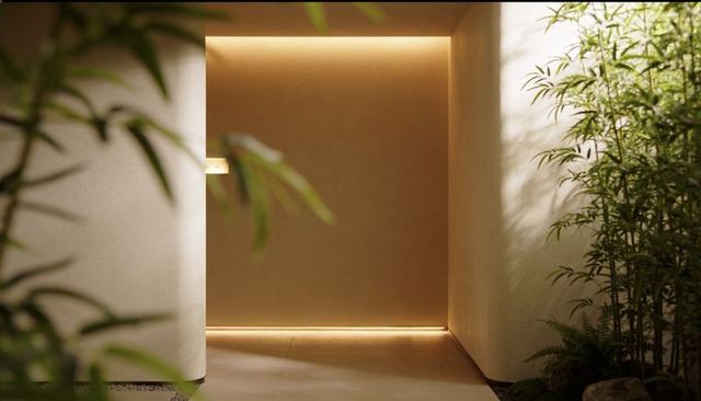 Minimal modern foyer with recessed led niche and bamboo greenery for serene interiors