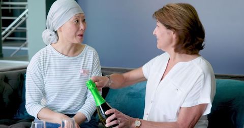 Senior multiracial friends celebrating friendship with champagne