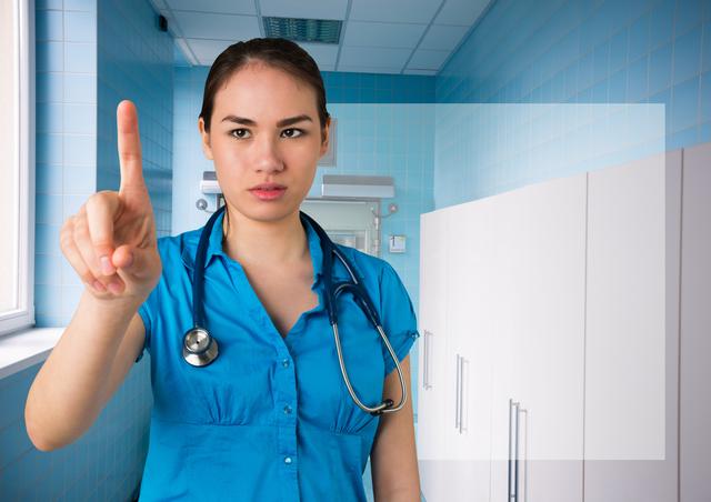 A female doctor standing in a modern hospital corridor, gesturing towards an invisible screen as if interacting with a digital interface. Ideal for illustrating concepts related to healthcare technology, digital health innovations, and modern medical practices. It can be used for medical websites, healthcare apps, and educational materials for showcasing advancements in medical technology.