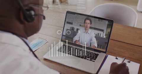 Businessman Engaged in Virtual Meeting Analyzing Data