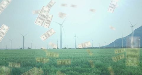 Wind Turbines in Field with Falling Money Symbolizing Renewable Profits