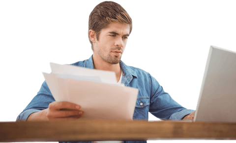 Focused Young Professional Reviewing Documents with Laptop Transparent Background - Download Free Stock Videos Pikwizard.com