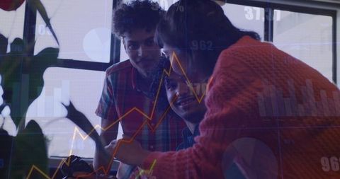 Woman pointing at tablet, colleague watching with data overlay, teamwork and collaboration