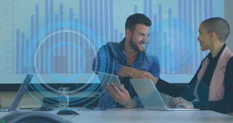 Diverse Business Meeting with Digital Interface Visualization