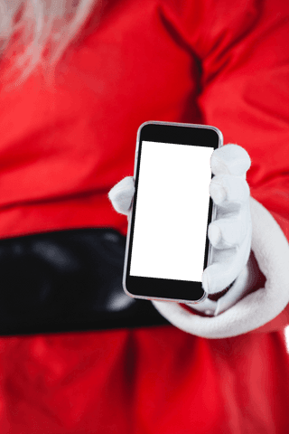 santa claus holding transparent mobile screen for creative apps - Download Free Stock Videos Pikwizard.com