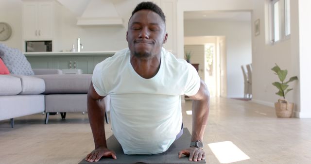 Determined Man Practicing Push-Ups in Cozy Living Room Setting - Download Free Stock Images Pikwizard.com