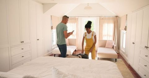 Couple Taking Selfie in Bright Home Bedroom