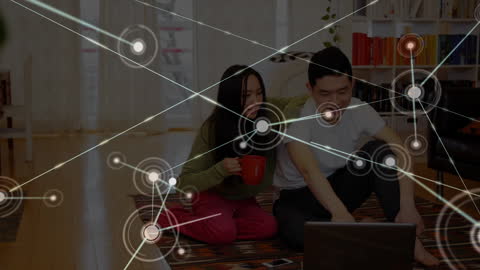 Couple Enjoying Home Office Setup with Network Graphics