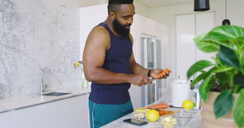 Man Preparing Fresh Ingredients in Modern Kitchen for Healthy Lifestyle