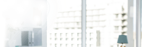 Brightly Lit Office With Large Transparent Glass Windows View On Urban cityscape