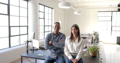 Business professionals discussing in modern office workspace