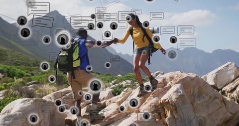 Hikers helping partner up rocky ridge with chat icons showing social connection
