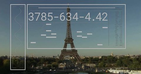 Eiffel tower rising with futuristic hud overlay from trocadero skyline, paris cityscape