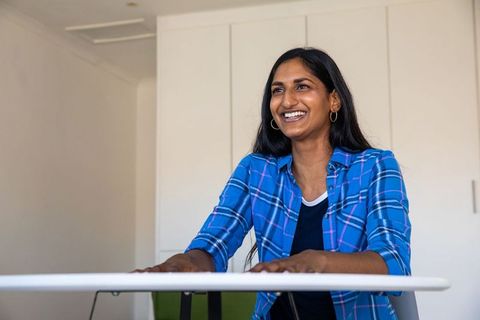 Smiling Woman Working in Minimalistic Modern Home Office