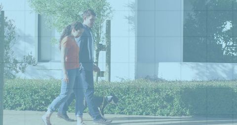 Couple Walking Dog by Modern Building on Sunny Day