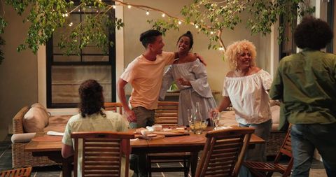 Diverse Group Enjoying Celebration Dinner Outdoors