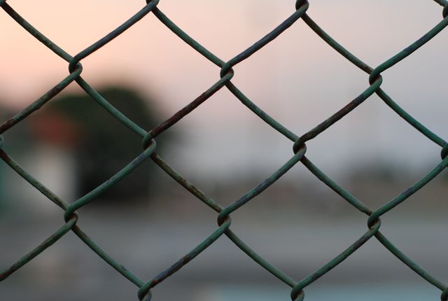 Closeup of Rusty Chain-link Fence at Sunset - Download Free Stock Photos Pikwizard.com