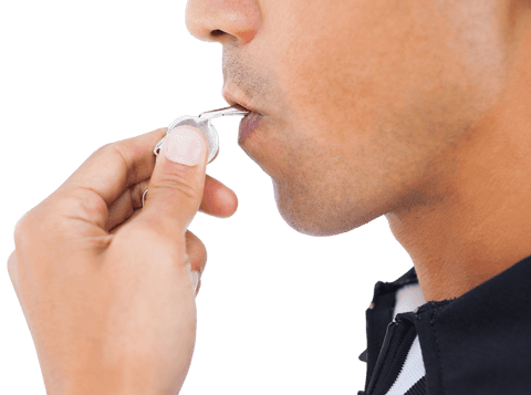 Close-up of referee in action blowing whistle transparent background