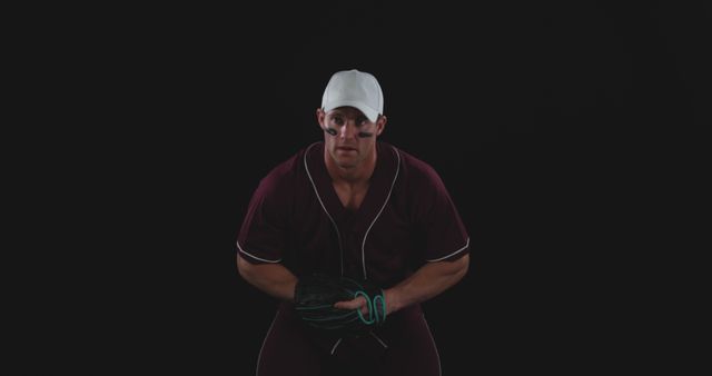 Focused Baseball Player Preparing for Pitch on Black Background - Download Free Stock Images Pikwizard.com