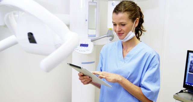 Smiling Female Dentist Using Digital Tablet in Modern Dental Clinic - Download Free Stock Images Pikwizard.com