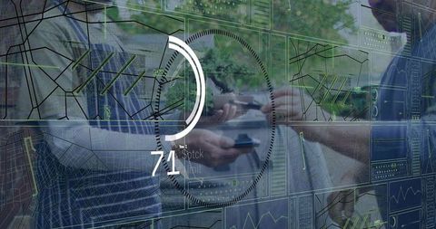 Executives comparing mobile data with analytics dashboard, finance charts, collaboration