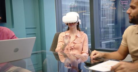 Woman Using VR Headset During Office Meeting for Interactive Collaboration