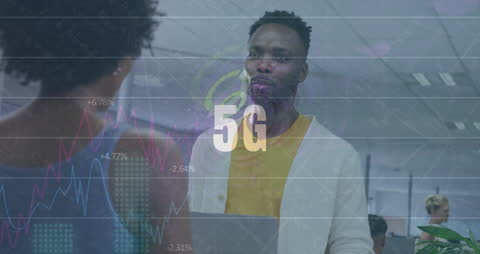 Diverse Team Analyzing Data in Modern Office with 5G Overlay