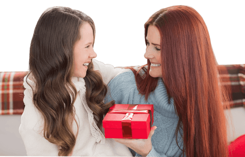 Happy Mother and Daughter Celebrating Christmas with Gift