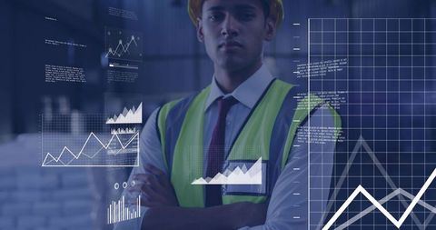 Monitoring engineer wearing hard hat and neon vest analyzing industrial data overlays