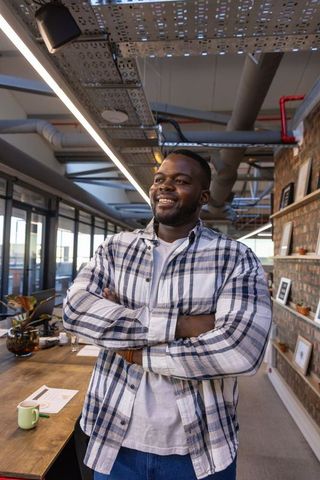 Confident Professional in Industrial Office Environment