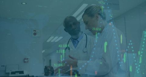 Doctors Analyzing Digital Data in Modern Hospital Corridor