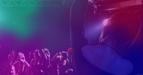 Singer energizing nightclub audience with dynamic performance