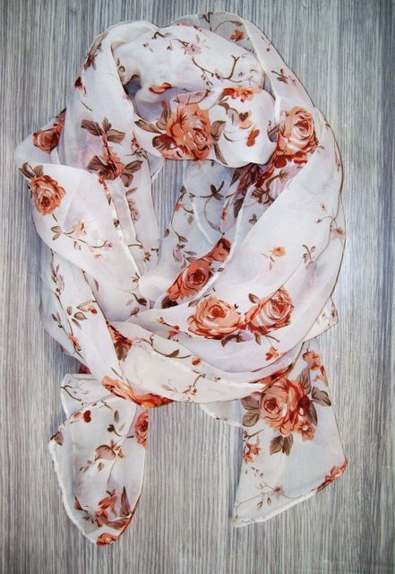 Elegant Floral Pattern Scarf on Wooden Surface - Download Free Stock Photos Pikwizard.com