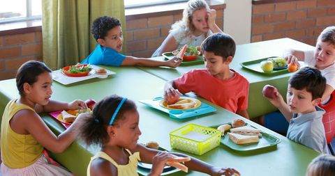 Diverse Group of Children Sharing Lunch in School Cafeteria - Download Free Stock Images Pikwizard.com