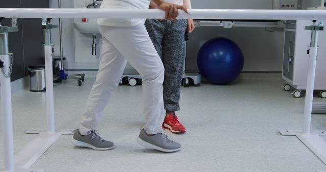 Physiotherapist Supporting Elderly Patient in Rehabilitation Room - Download Free Stock Images Pikwizard.com