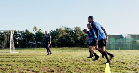 Soccer Training Session on Suburban Field with Enthusiastic Athletes