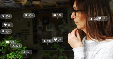 Pensive Woman in Creative Studio Surrounded by Social Media Icons