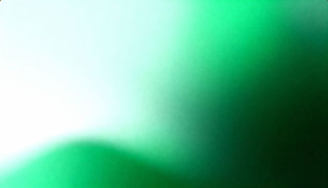 Glowing green abstract gradient blur with soft vignette for minimal backgrounds