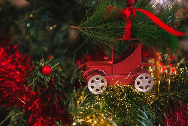 Close-up of Christmas Tree Decorations with Red Car Ornament - Download Free Stock Photos Pikwizard.com