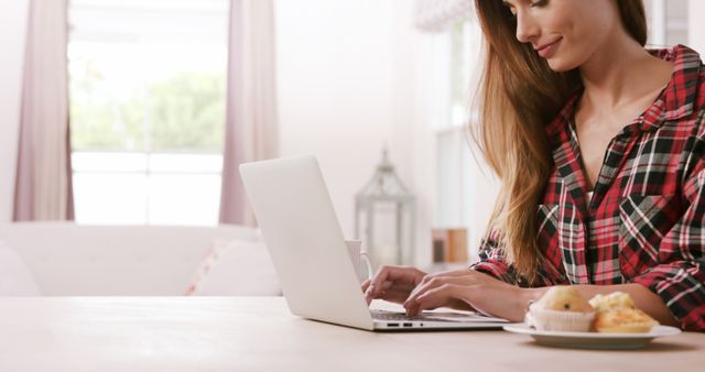 Young Woman Using Laptop in Cozy Home Environment - Download Free Stock Images Pikwizard.com