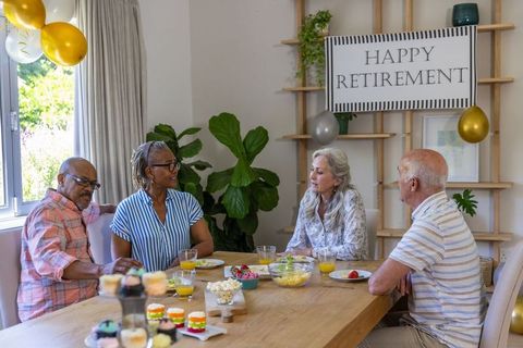 Diverse Senior Friends Celebrating Retirement at Home with Joy