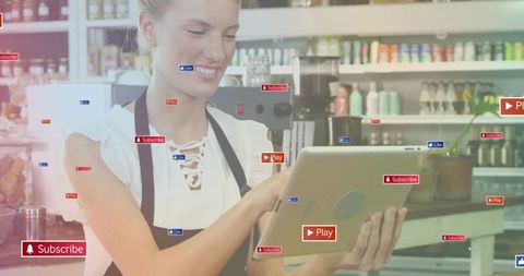 Smiling cafe worker tapping tablet with digital interface
