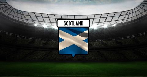 Scotland Flag Hovering Over Illuminated Stadium