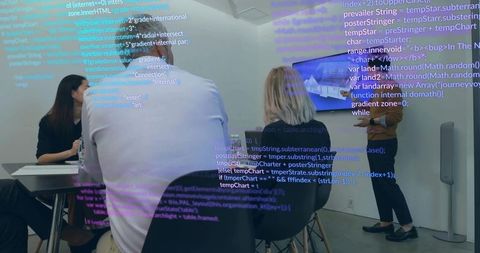 Software team analyzing code in modern office meeting