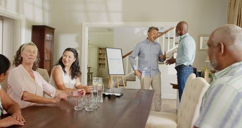 Diverse Group of Seniors Celebrating Together at Home